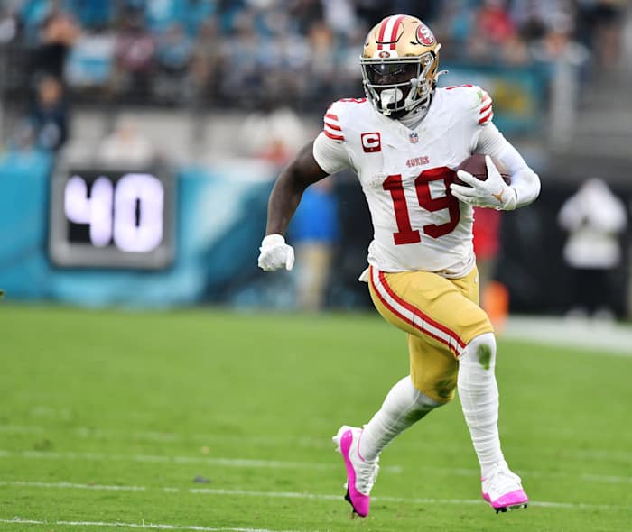 San Francisco 49ers wide receiver Deebo Samuel runs with the football.